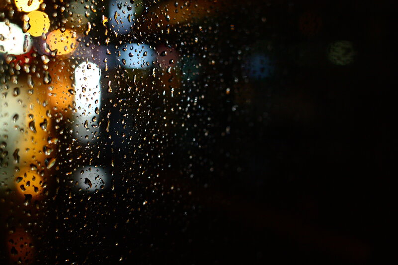 raindrops on a window at night
