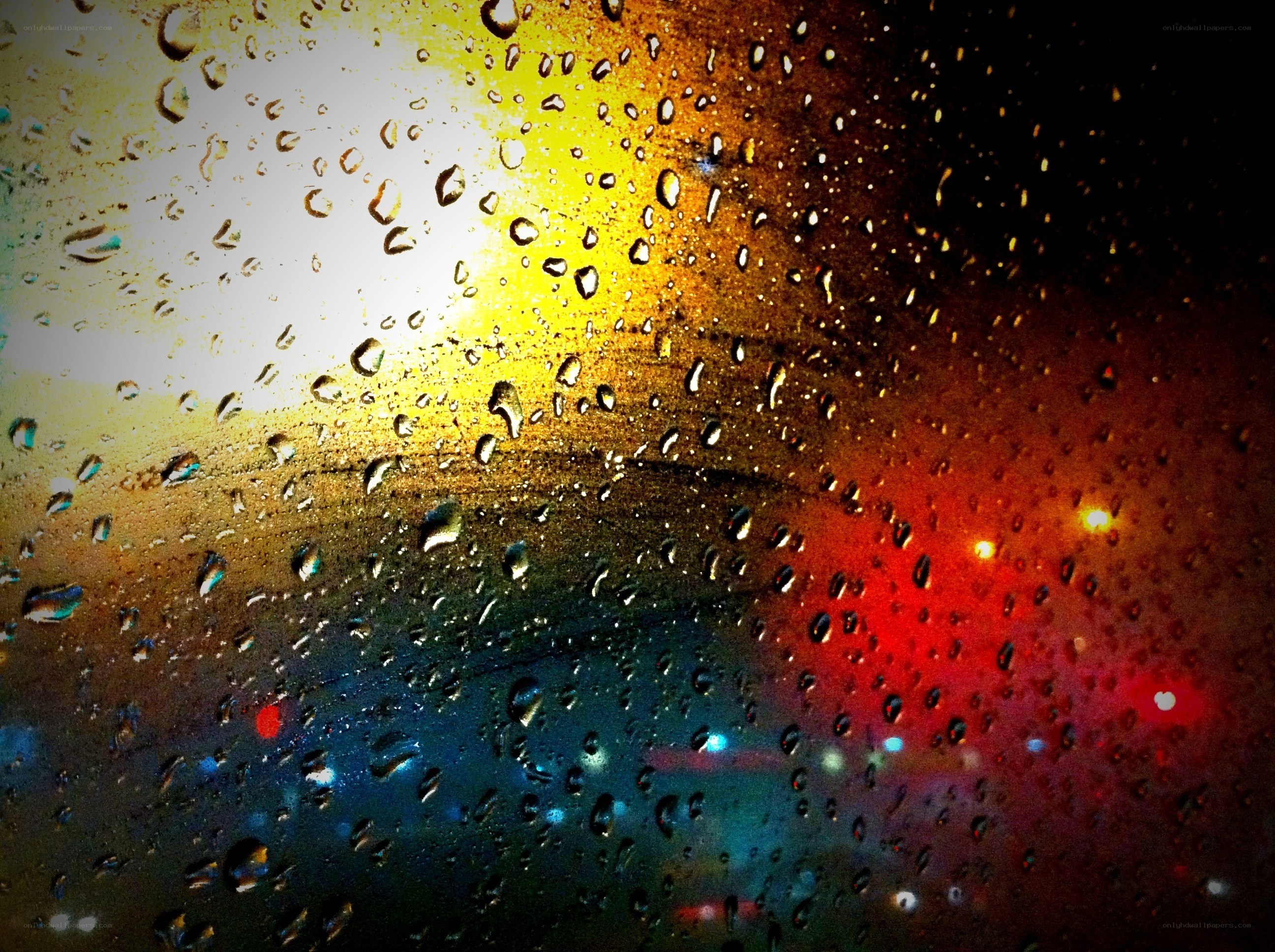 raindrops on a window at night