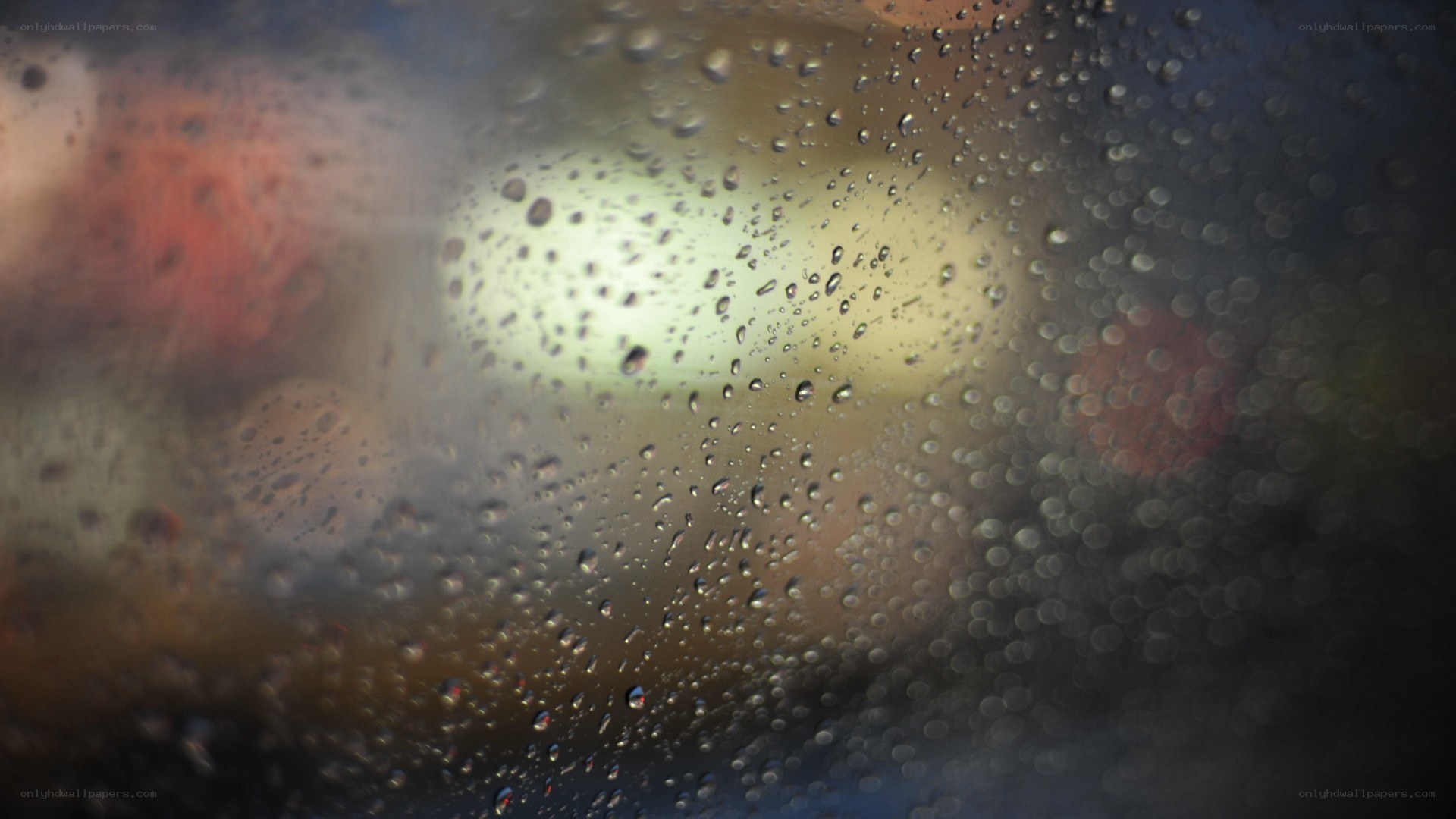 raindrops on a window at night