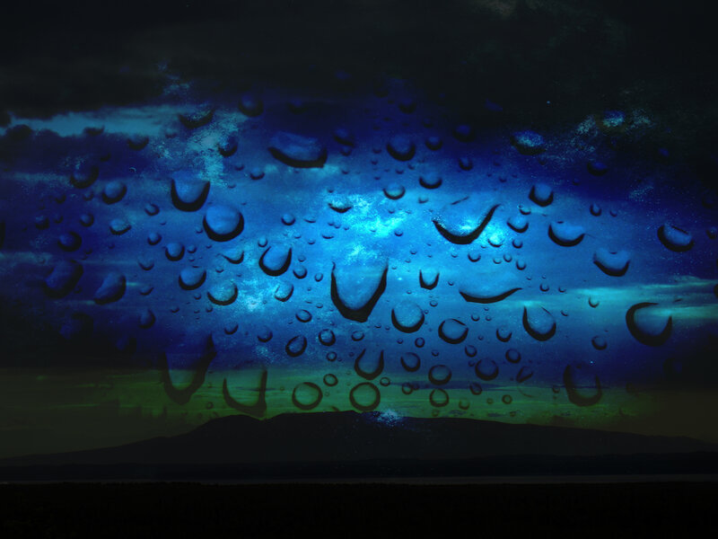raindrops on a window at night