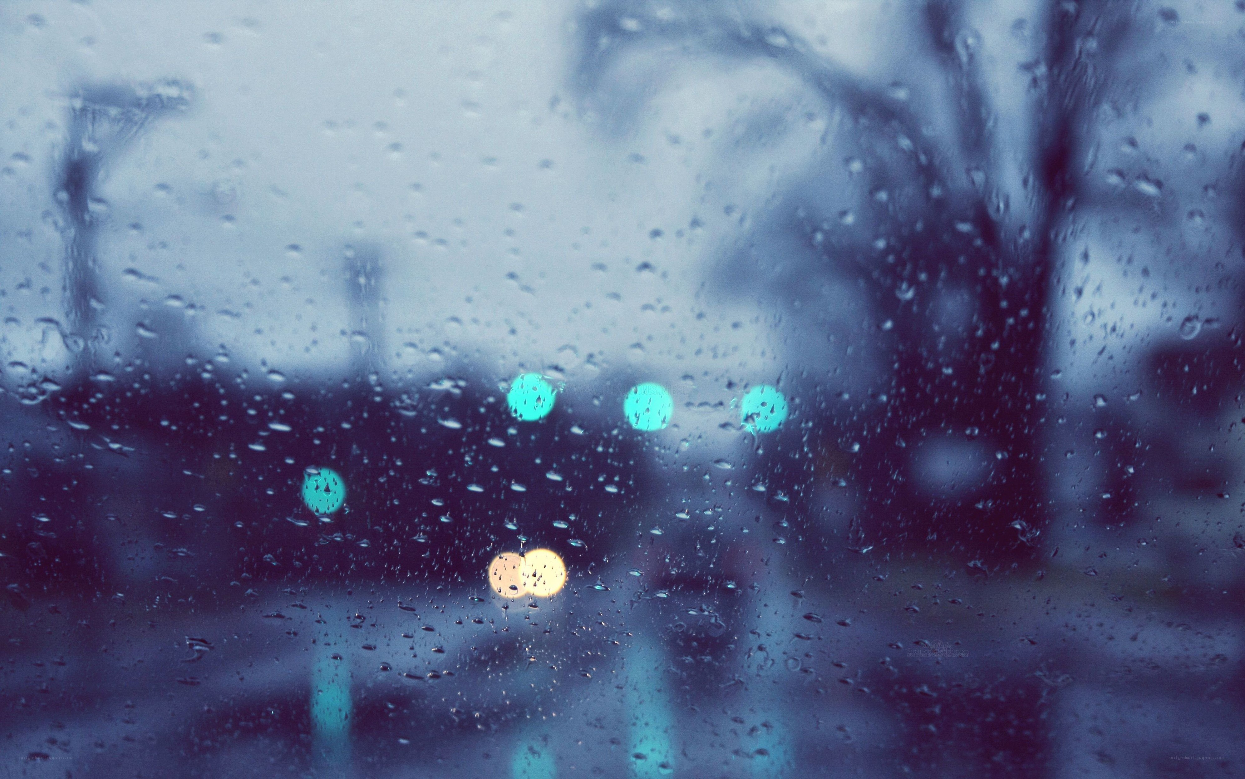 Raindrops on a window at night