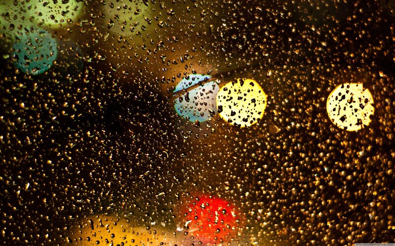 raindrops on a window at night
