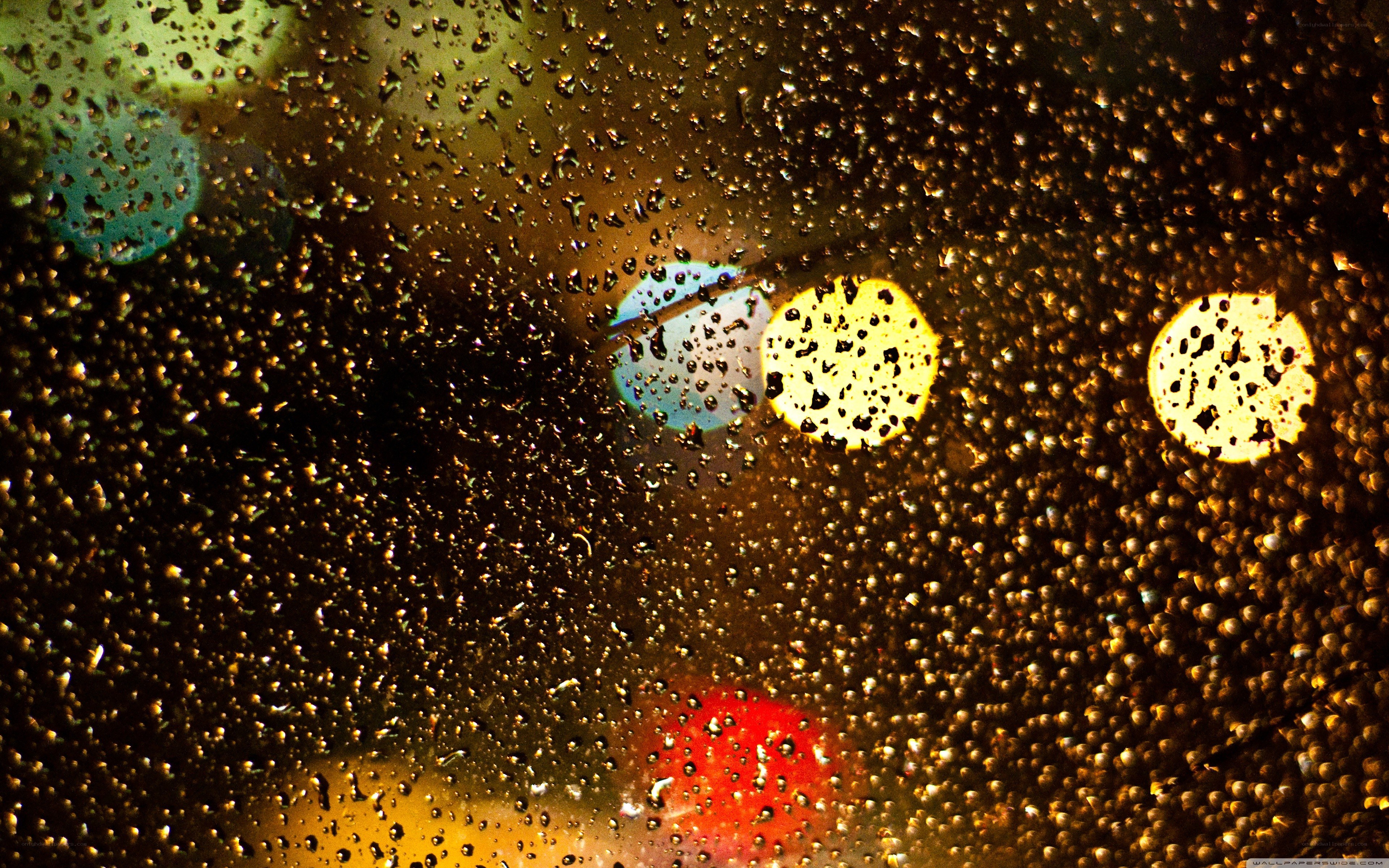 raindrops on a window at night
