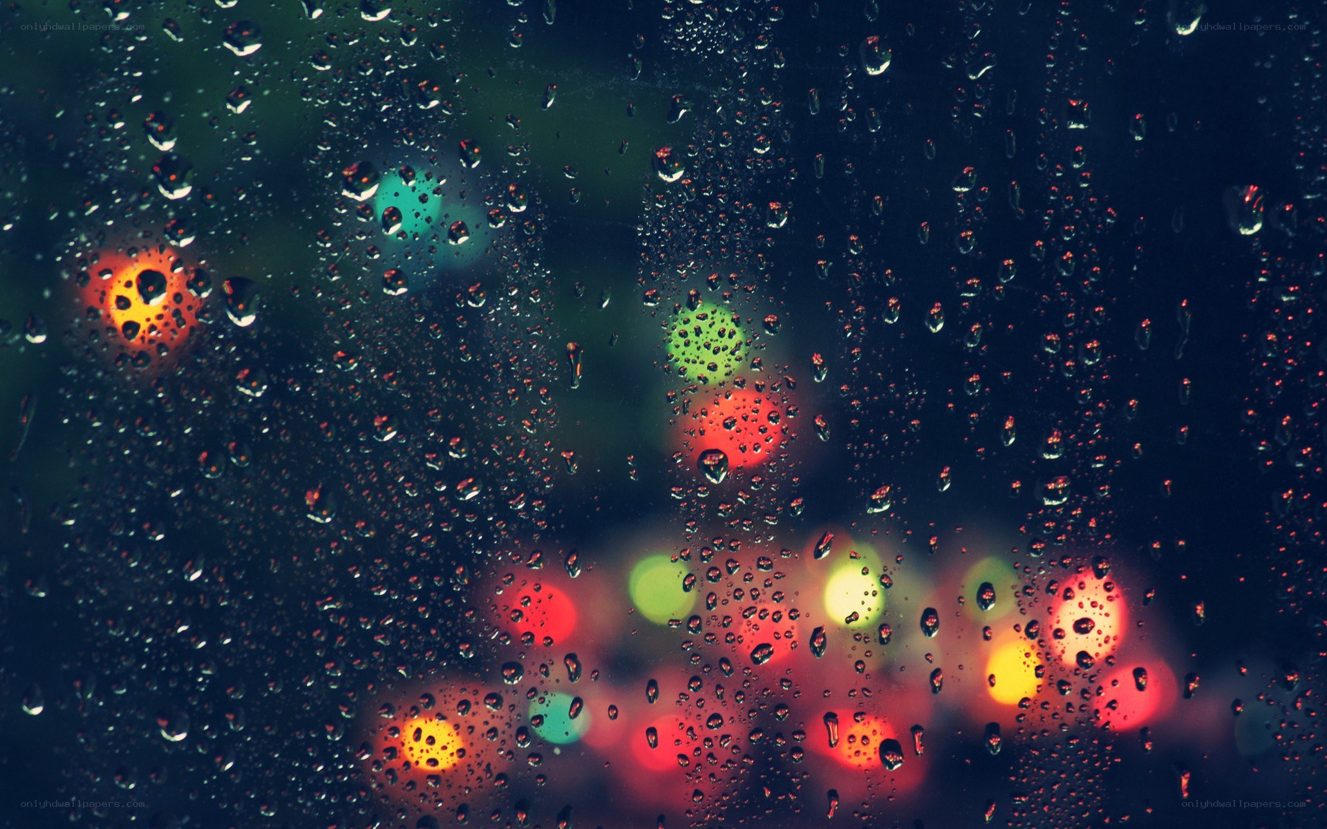 raindrops on a window at night