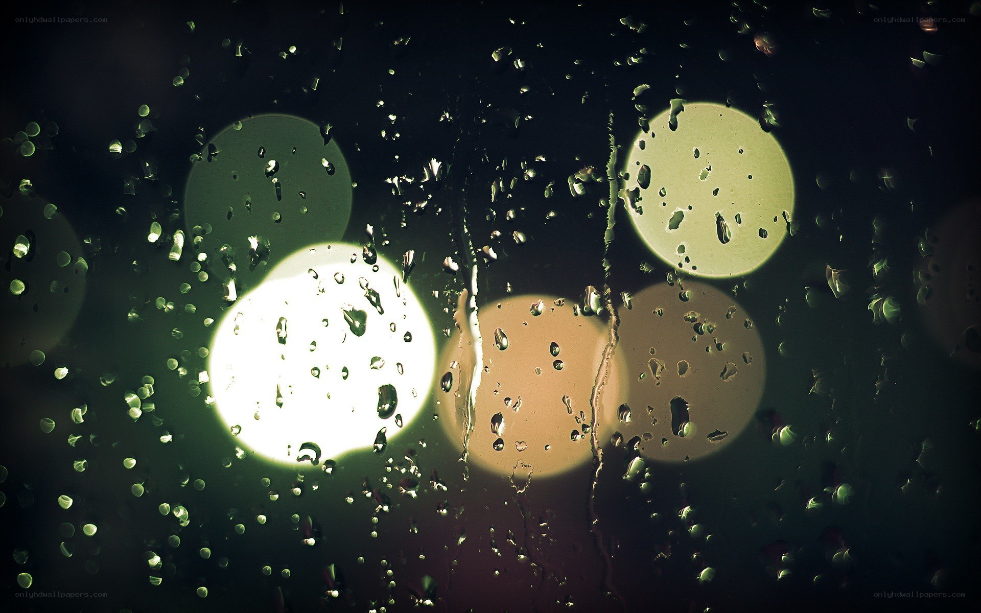 raindrops on a window at night