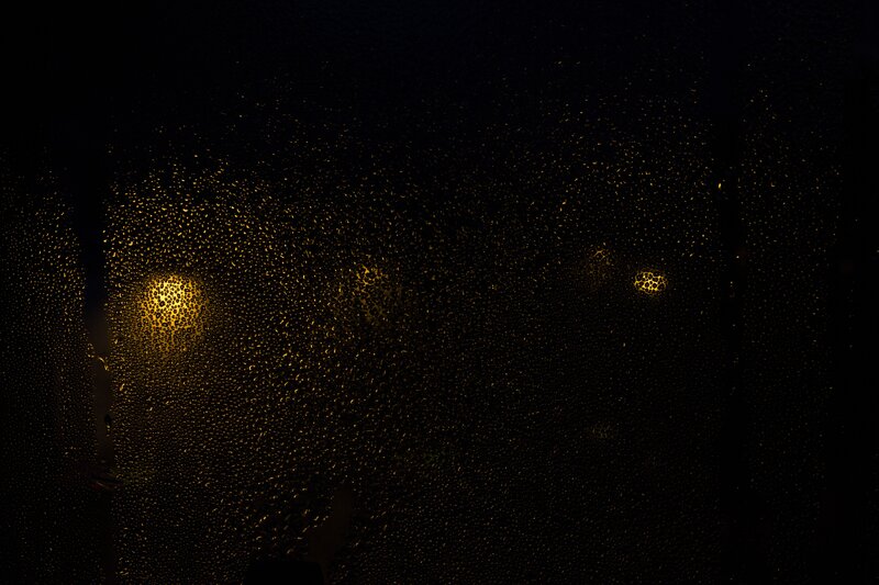 raindrops on a window at night