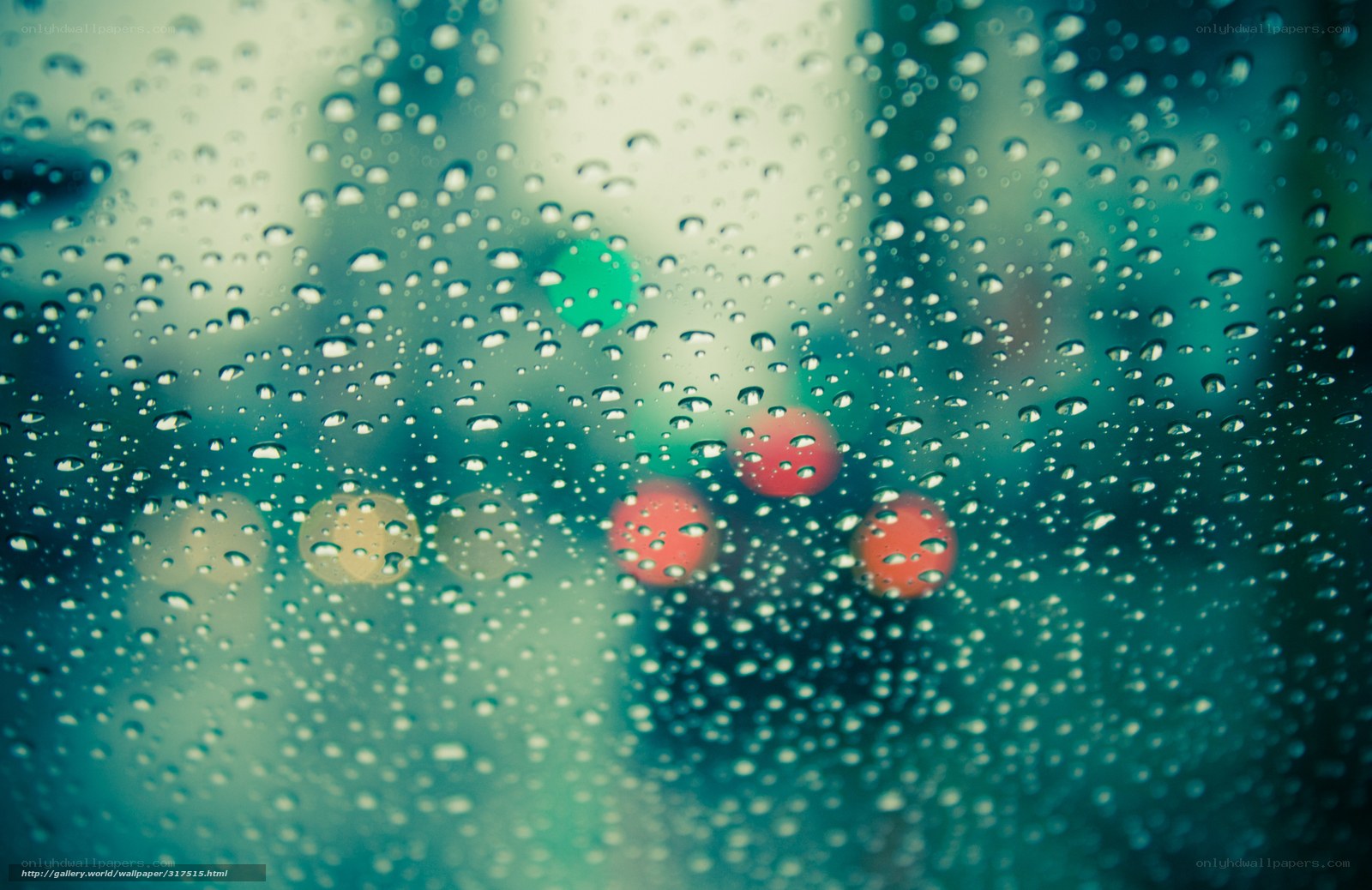 raindrops on a window with city lights