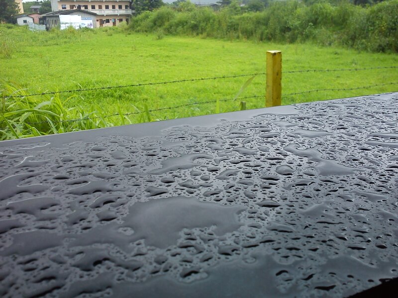 Raindrops on Black Surface — Green, Calm
