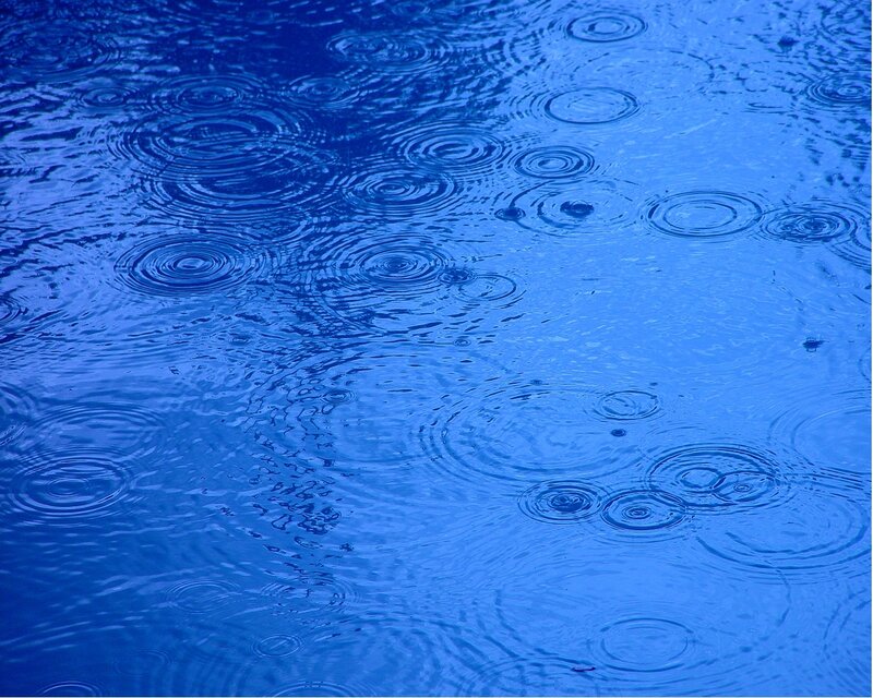 raindrops on blue water