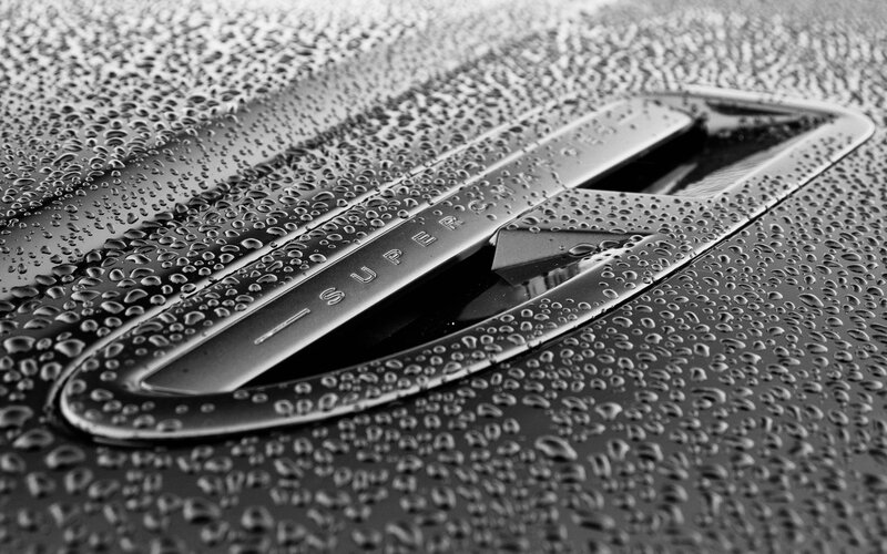 Raindrops on car emblem