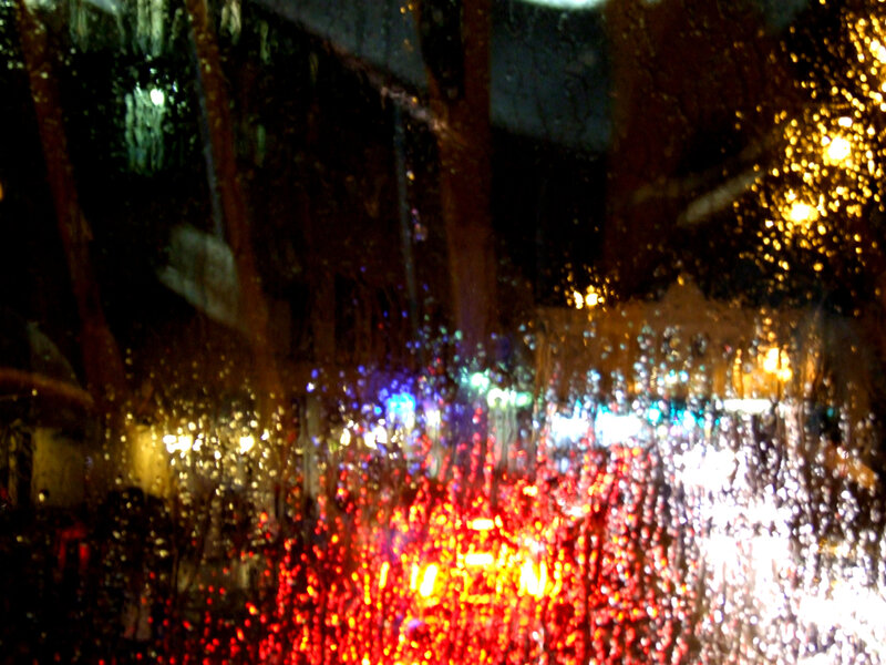 Raindrops on Car Window — Red, Blurry
