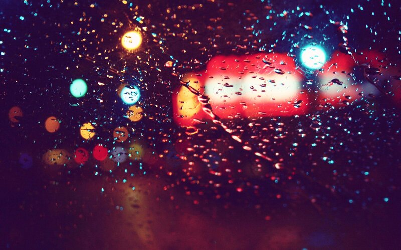 Raindrops on Car Window — Red
