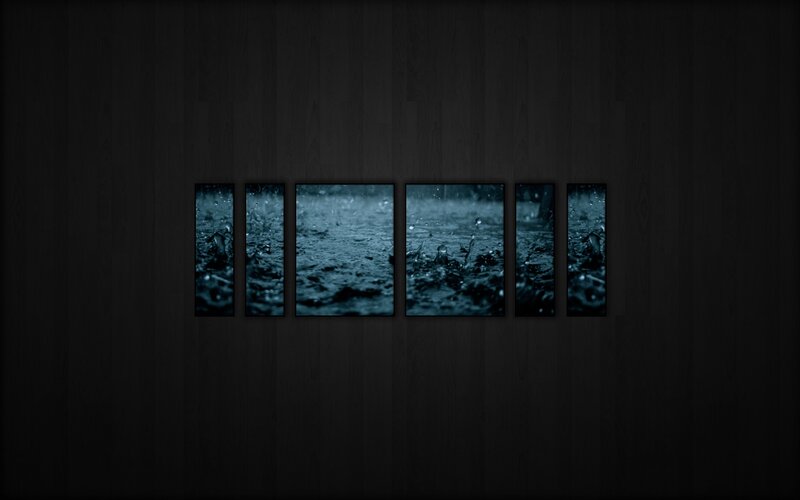 Raindrops on dark surface