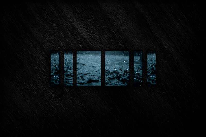 Raindrops on dark surface