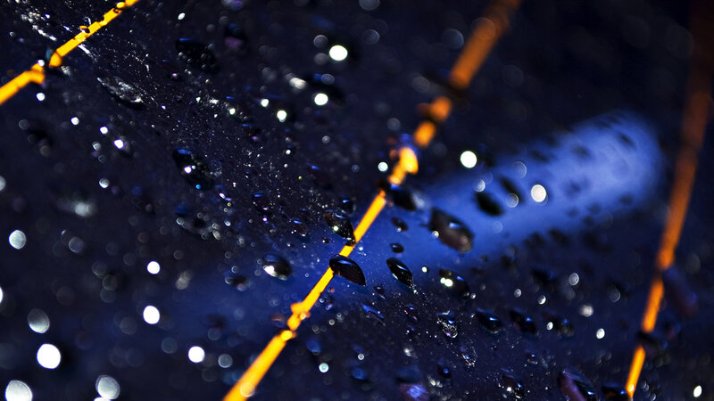raindrops on dark surface