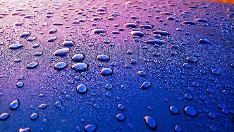 Raindrops on Dark Surface — Blue, Calm, Sunset