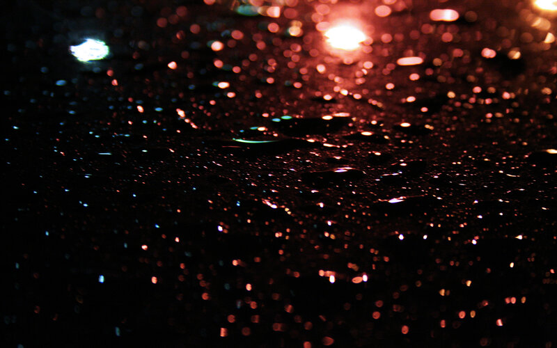 raindrops on dark surface