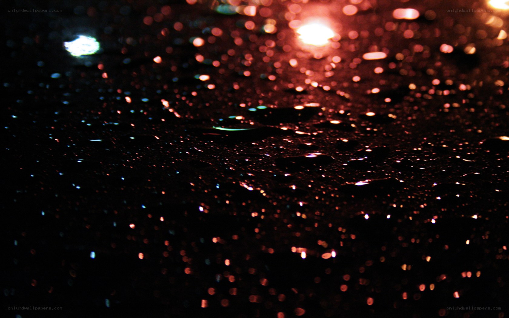raindrops on dark surface