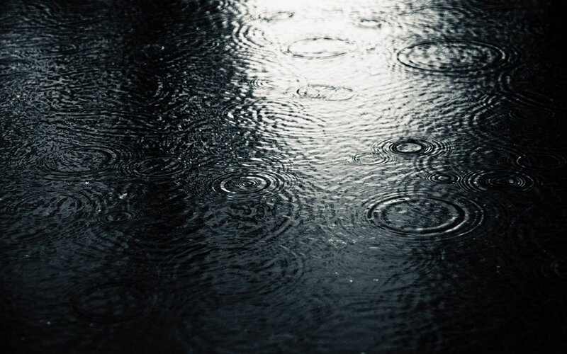 raindrops on dark water