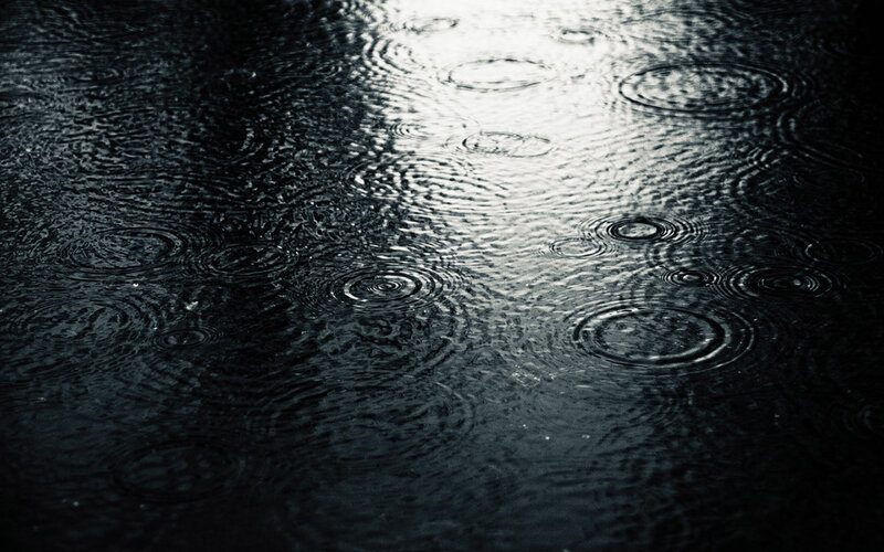 raindrops on dark water