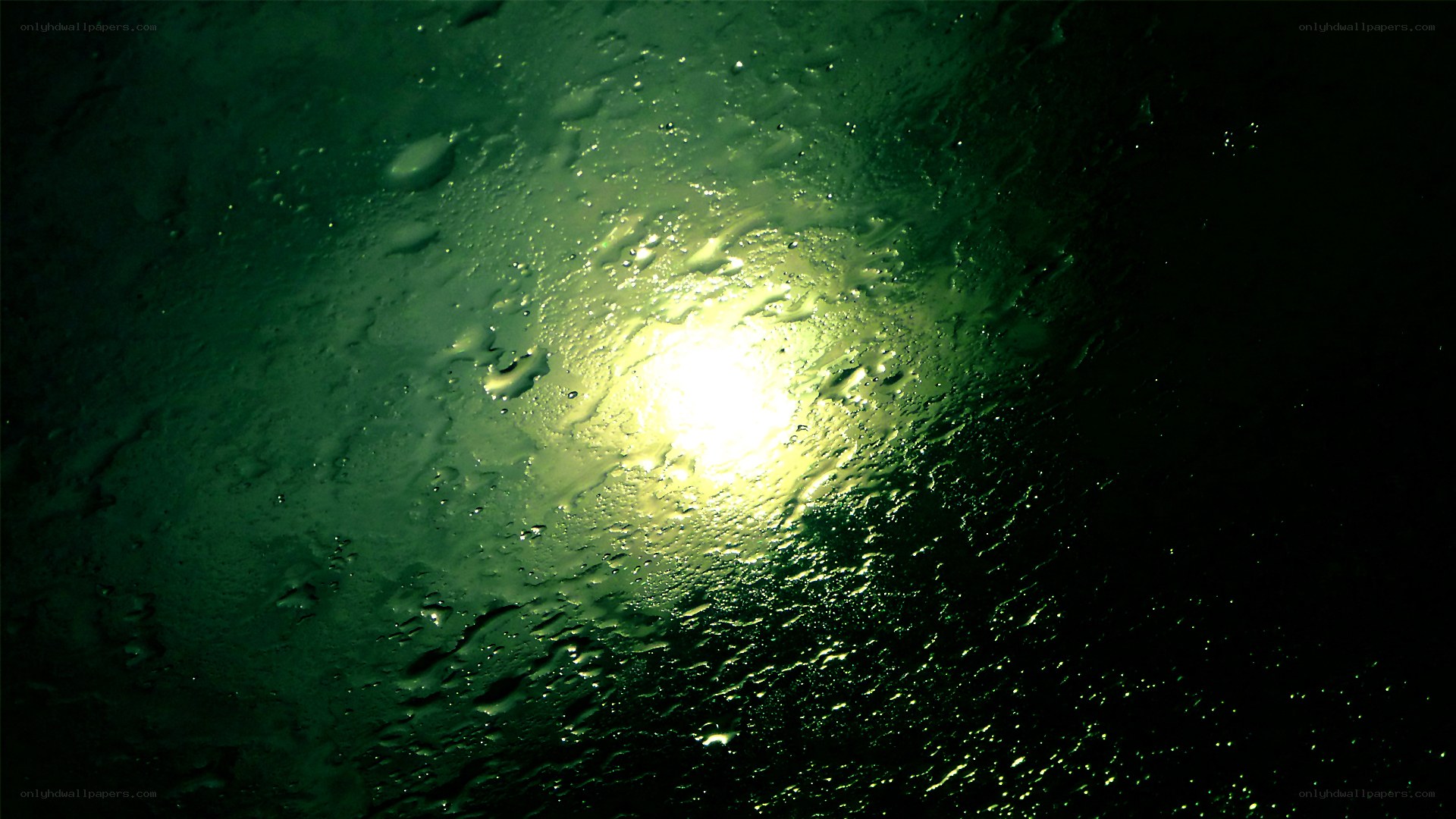 raindrops on glass with light