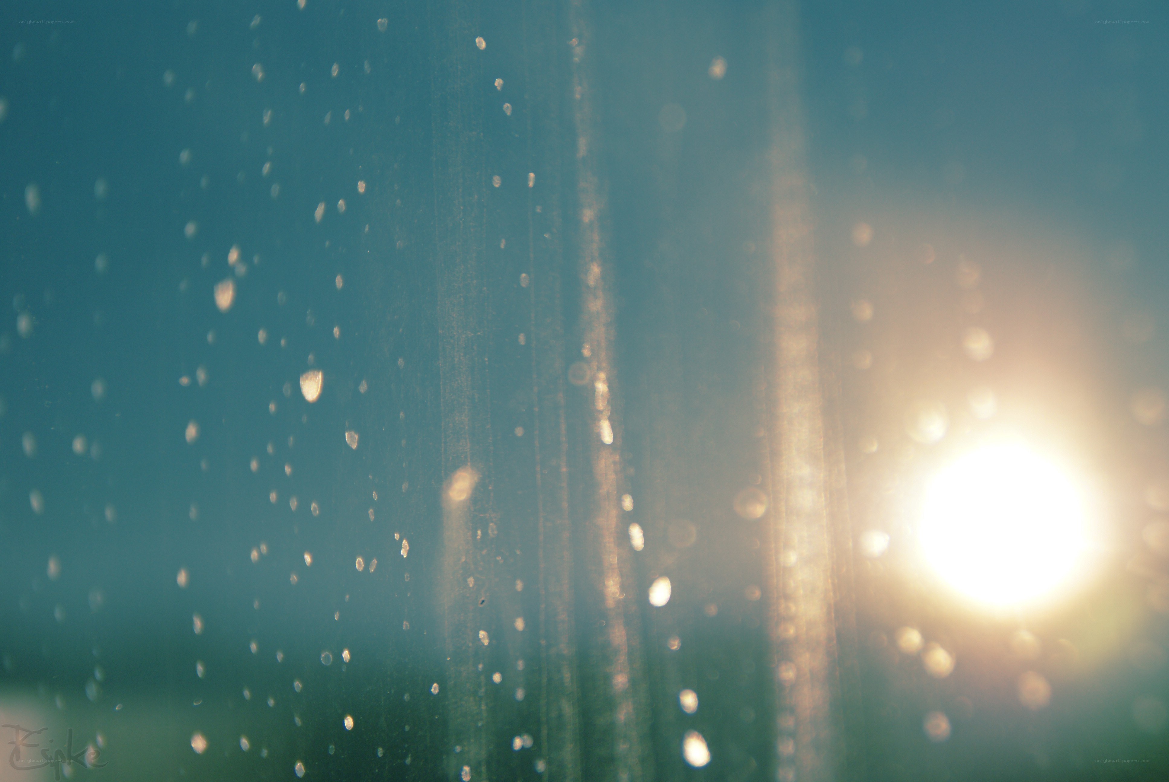 raindrops on glass with sunlight