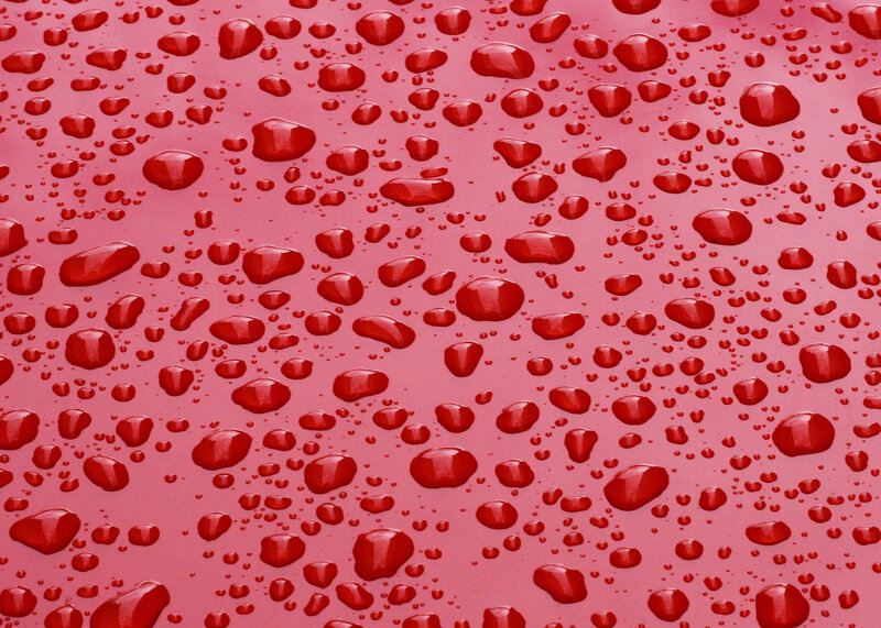 Raindrops on Red Surface