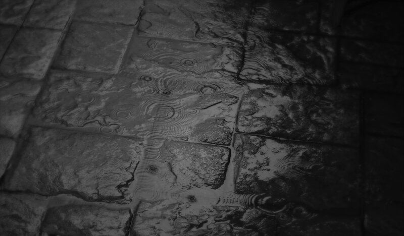 raindrops on stone pavement