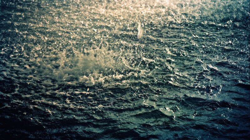 Raindrops on Water Surface — Blue, Dramatic