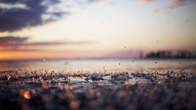 Raindrops on Water Surface — Orange, Serene, Sunset, Photograph, Sky