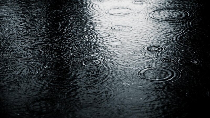 Raindrops on Water Surface — Photograph