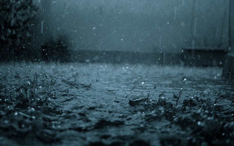 Raindrops on Wet Ground — Photograph