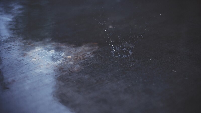 raindrops on wet pavement
