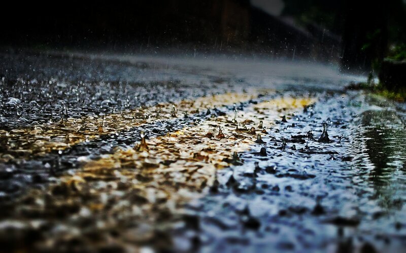 Raindrops on Wet Pavement — Black, Dramatic