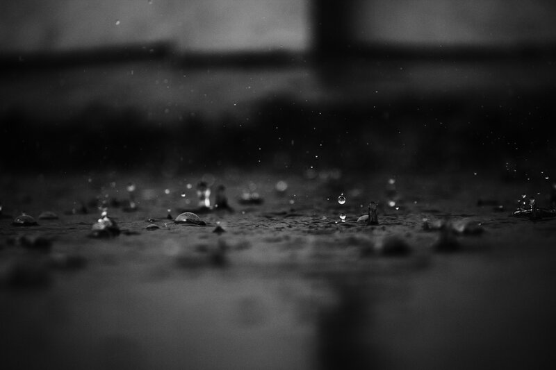 Raindrops on Wet Surface — Black
