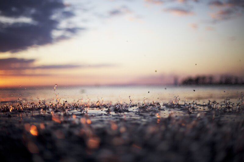 Raindrops on Wet Surface — Orange, Serene