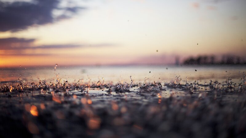 Raindrops on Wet Surface — Orange