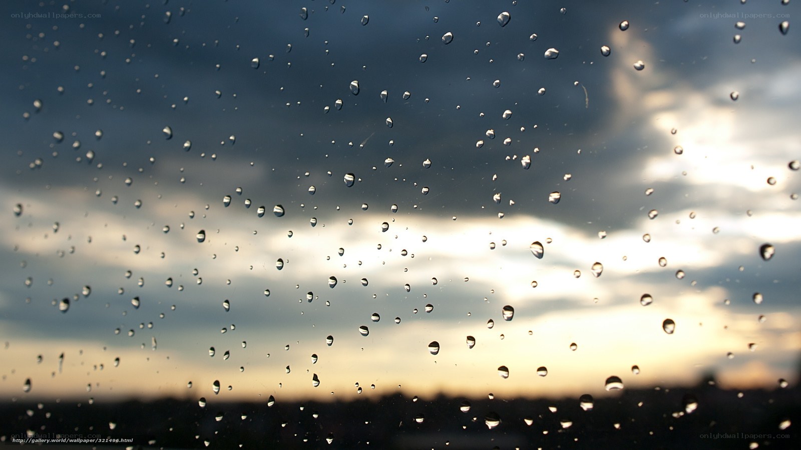 raindrops on window at sunset
