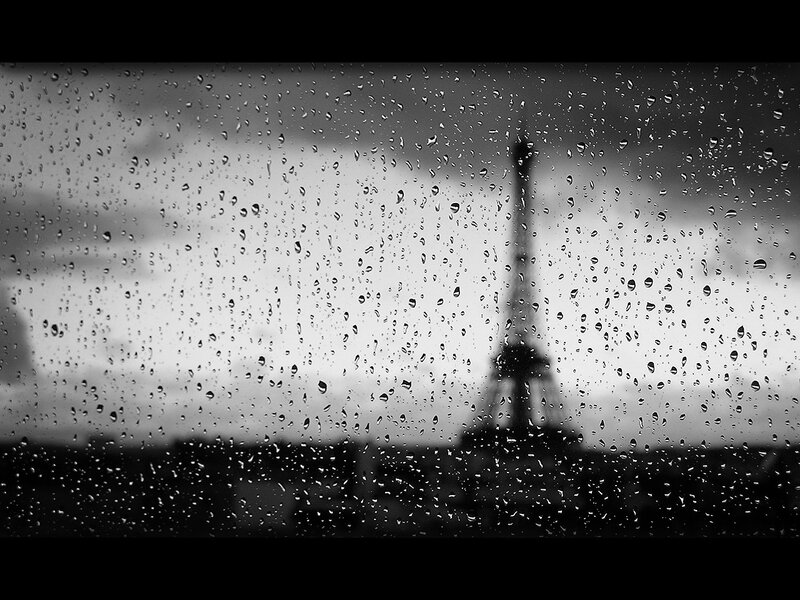 Raindrops on window with Eiffel Tower