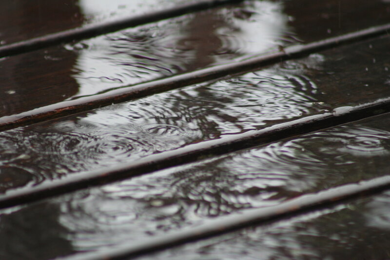 raindrops on wooden deck