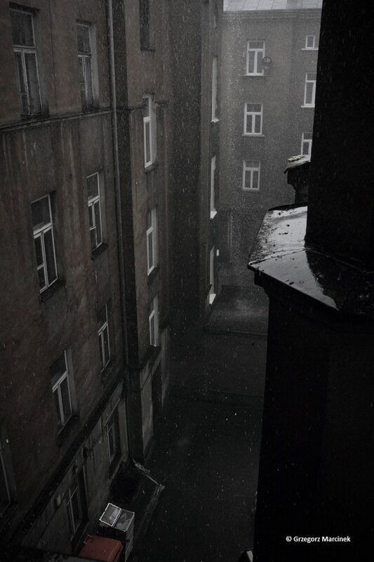 Rainy alley between buildings