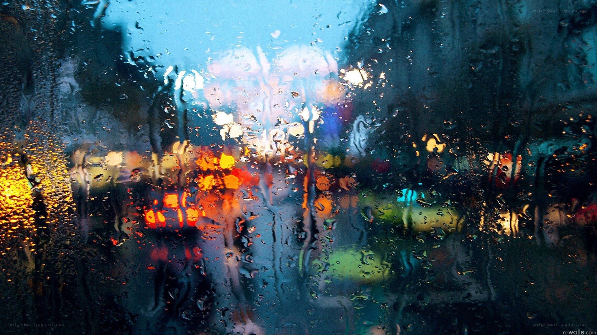 rainy city lights through glass