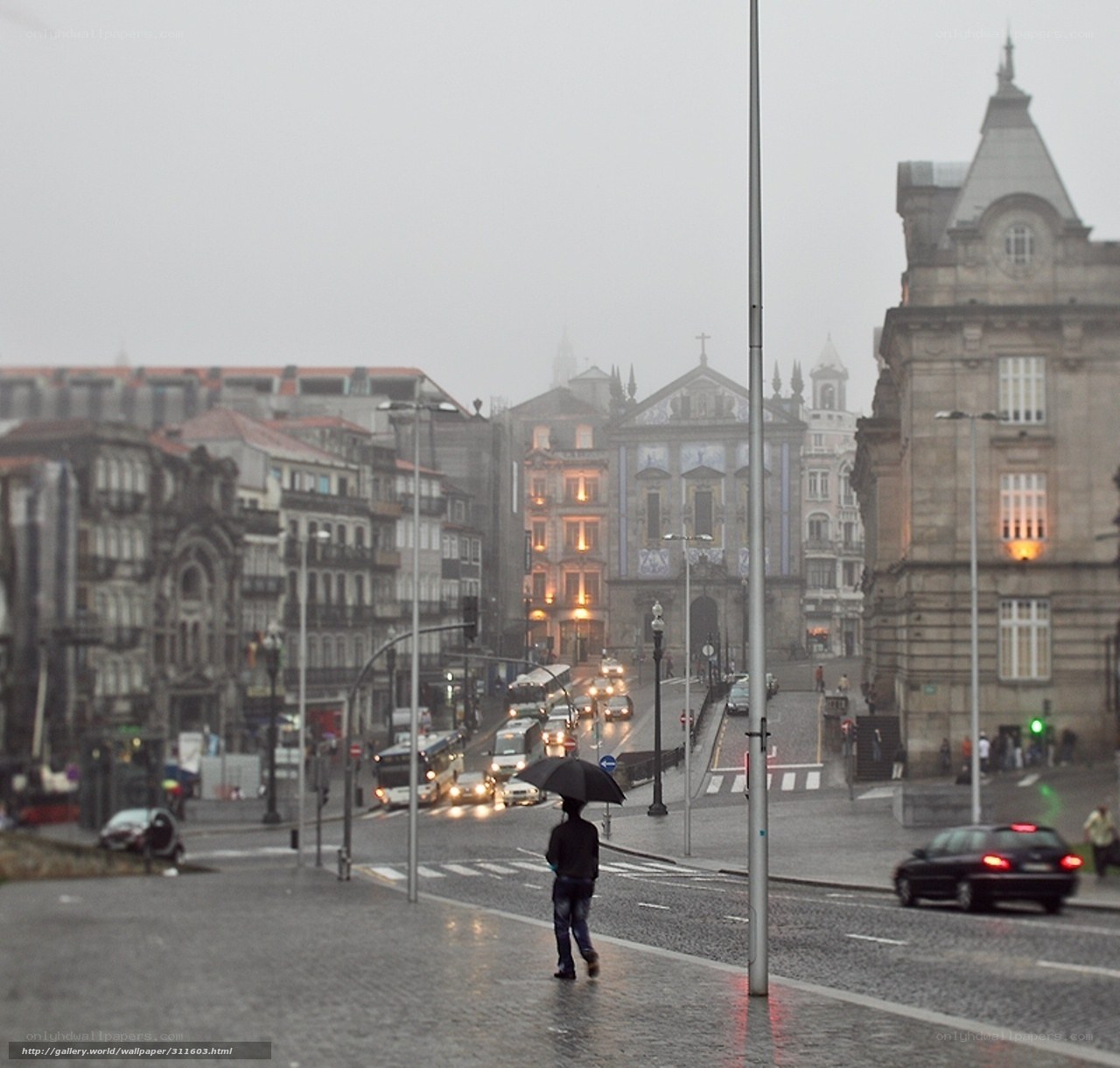 Rainy city street with cathedral