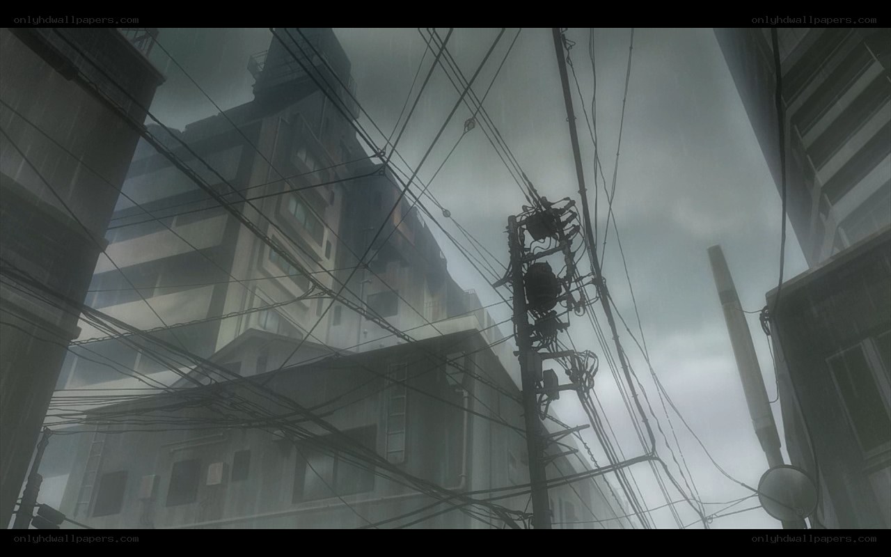 rainy city street with power lines