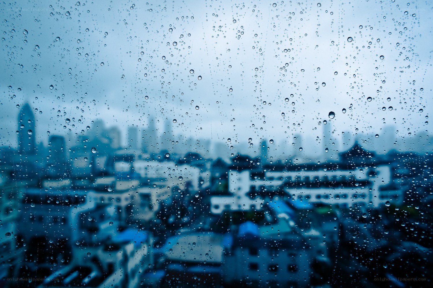 rainy city view from window