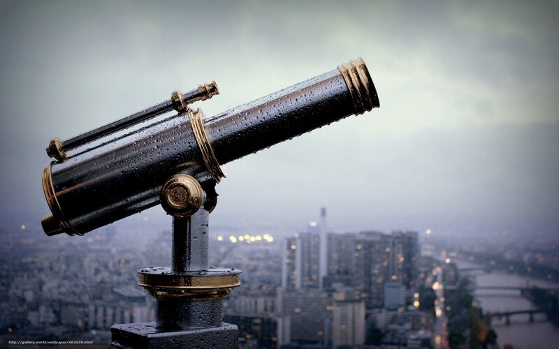 Rainy city view through binoculars