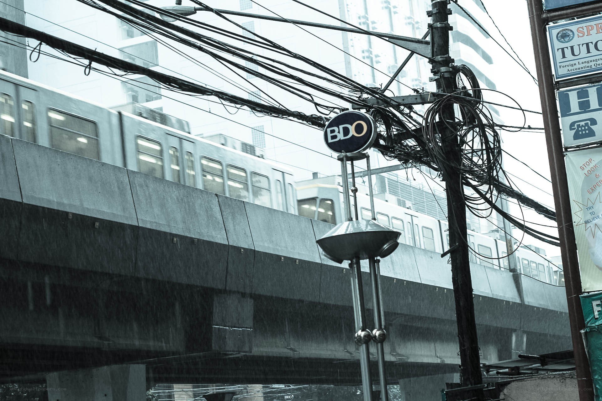 Rainy day with train and wires
