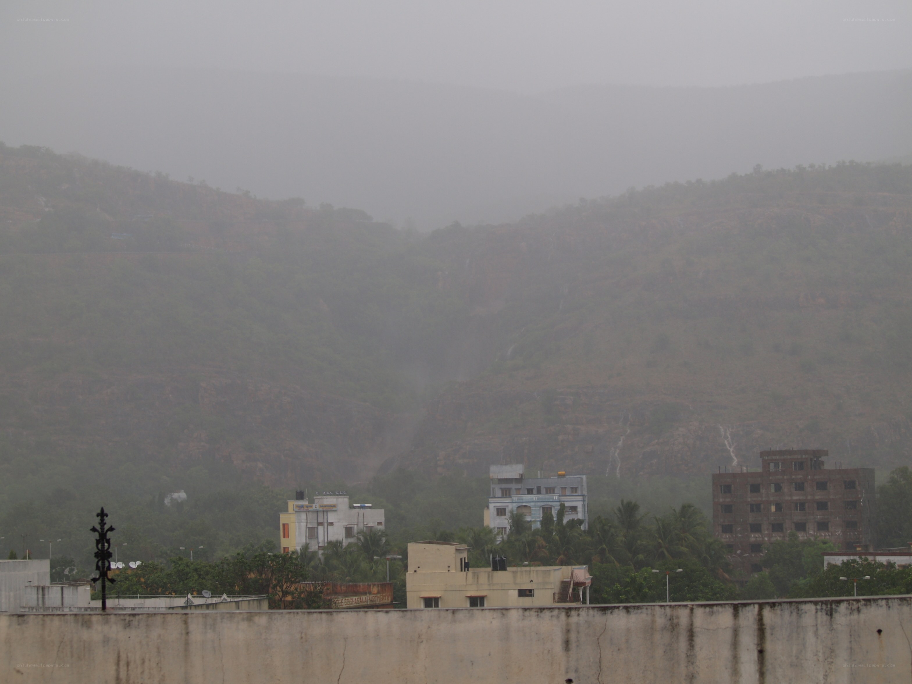 Rainy mountains with buildings