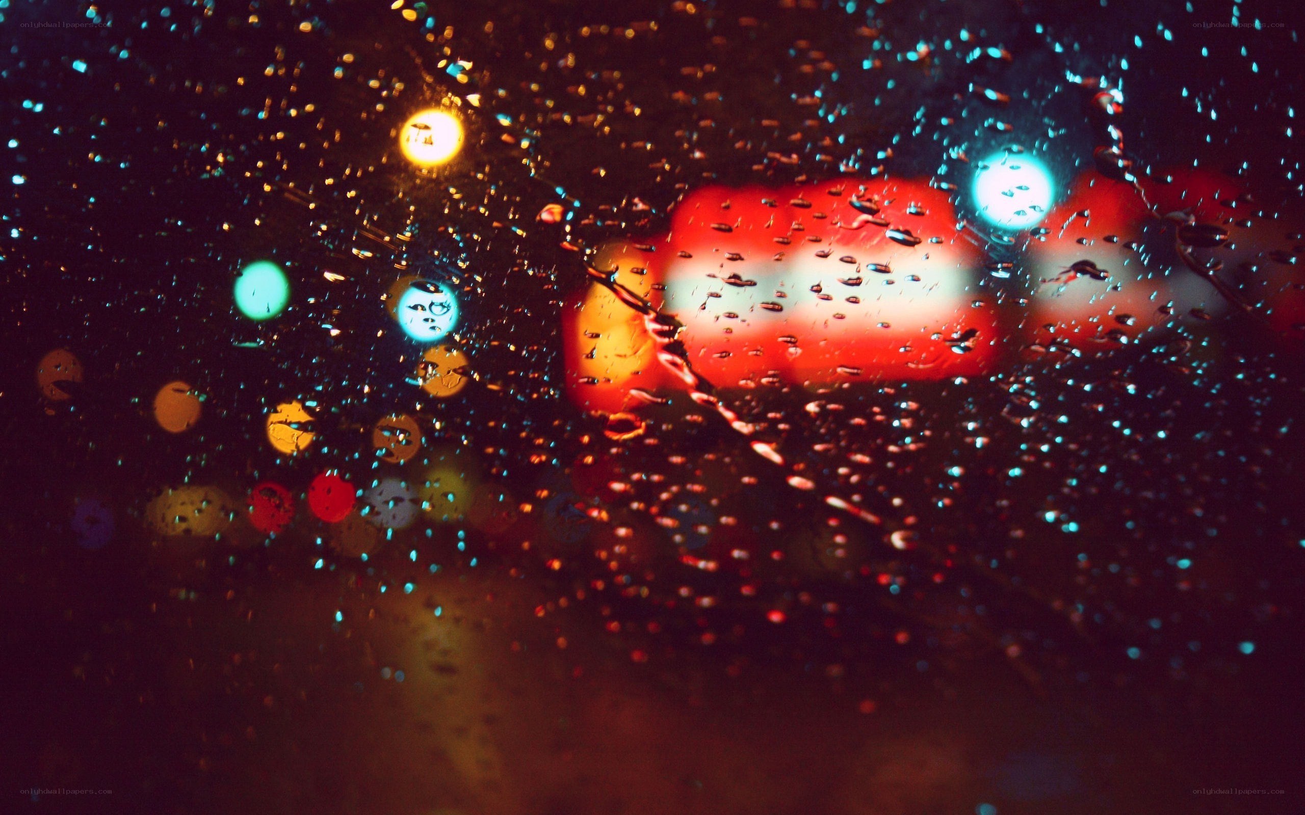 rainy night lights through a window