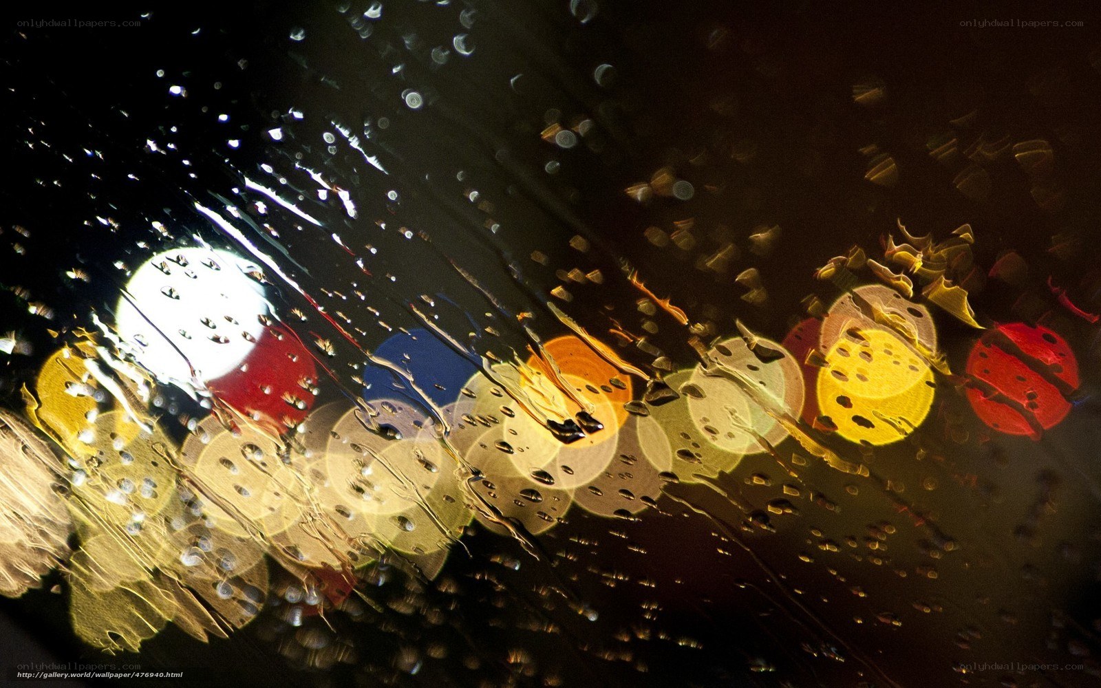 Rainy night lights through glass